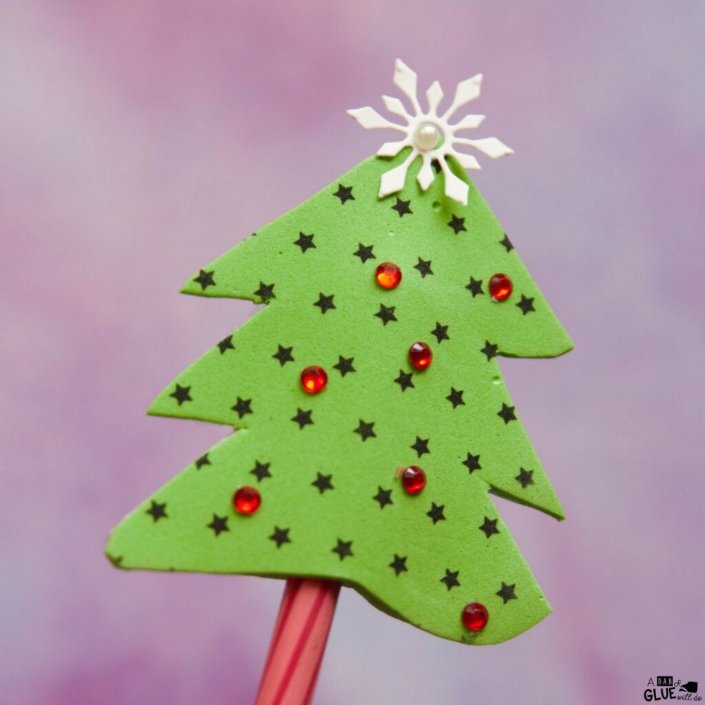 Kindergarten studnets will love Christmas Tree Pencil Topper as their next Christmas craft! This is a great fine motor craft for kids and holiday craft too.