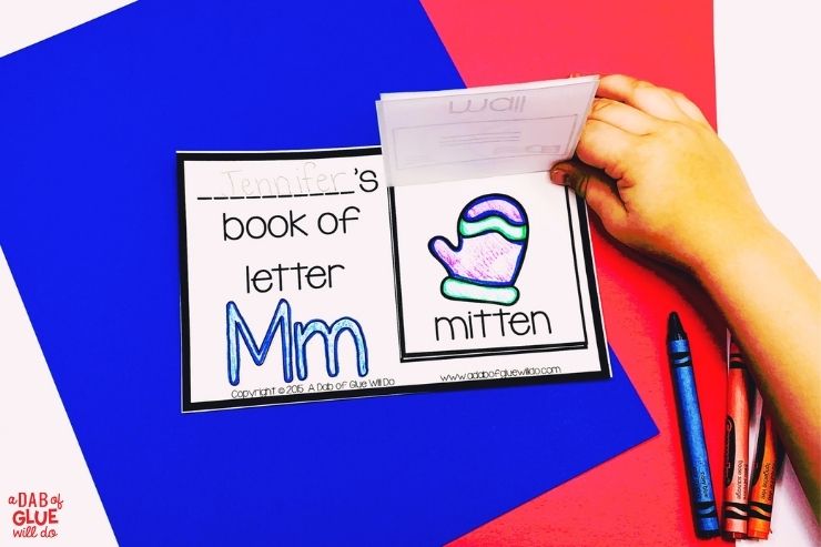 child start flipping through the completed letter m alphabet flip book