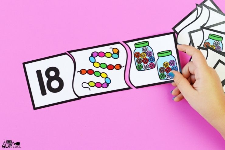 child matching number 18 with beads and buttons puzzle pieces