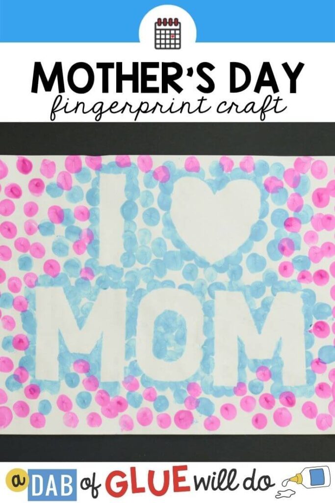 a piece of paper with "i heart mom" outlined with pink and blue paint fingerpaint