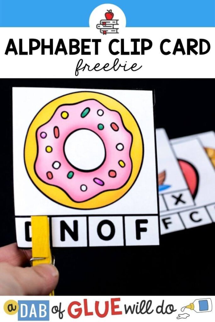 A card with a donut on it with 4 letters on the bottom and a yellow clothespin covering the letter D.