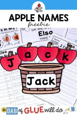 A paper basket with the name Jack on it with apples on top that spell out the name.