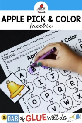 A paper with apples on it that have the letters of the alphabet on them and a picture card with a bell on it with a child coloring in the letter B with a purple crayon.