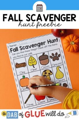 A child checking off a paper titled "Fall Scavenger Hunt" with pictures of different outdoor fall items on it.
