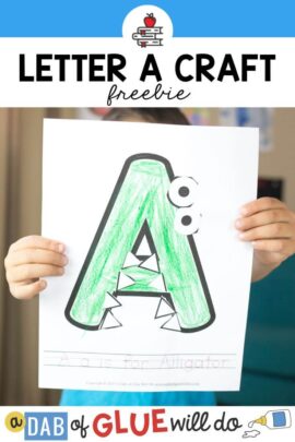 A child holding up an A is for Alligator Craft up