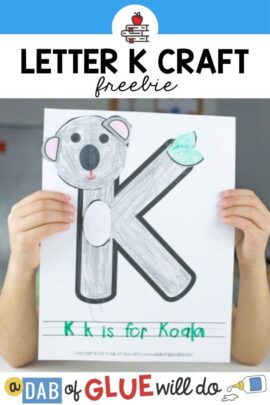 A child holding up a K is for Koala craft