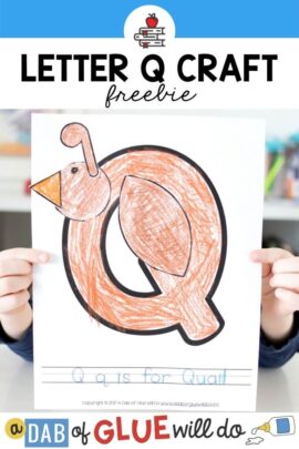A child holding a Q is for Quail craft