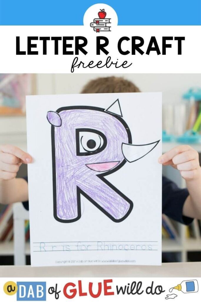A child holding up an R is for Rhino craft