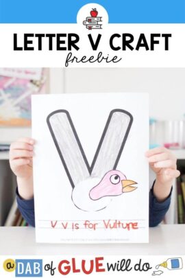 A child holding up a v is for vulture craft