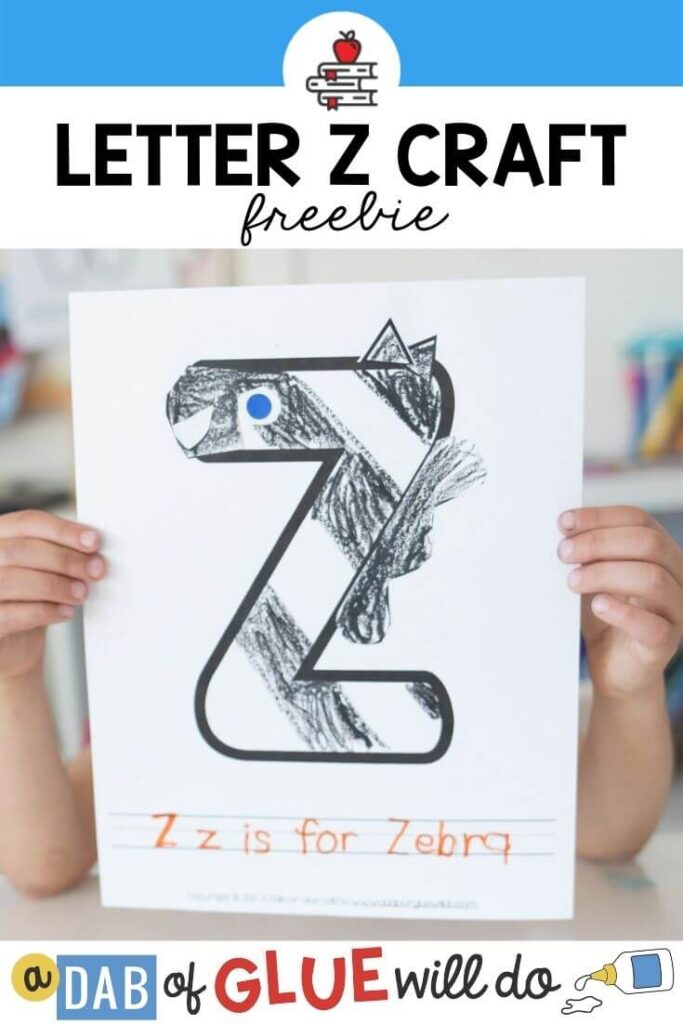 A child holding a Z is for zebra craft