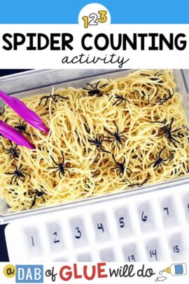 A box of spaghetti with plastic spiders in it with purple tongs and an ice tray with numbers written on the bottom.