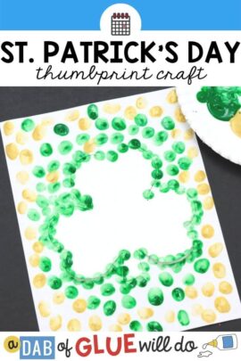 an outline of a shamrock surrounded with gold and green painted fingerprints