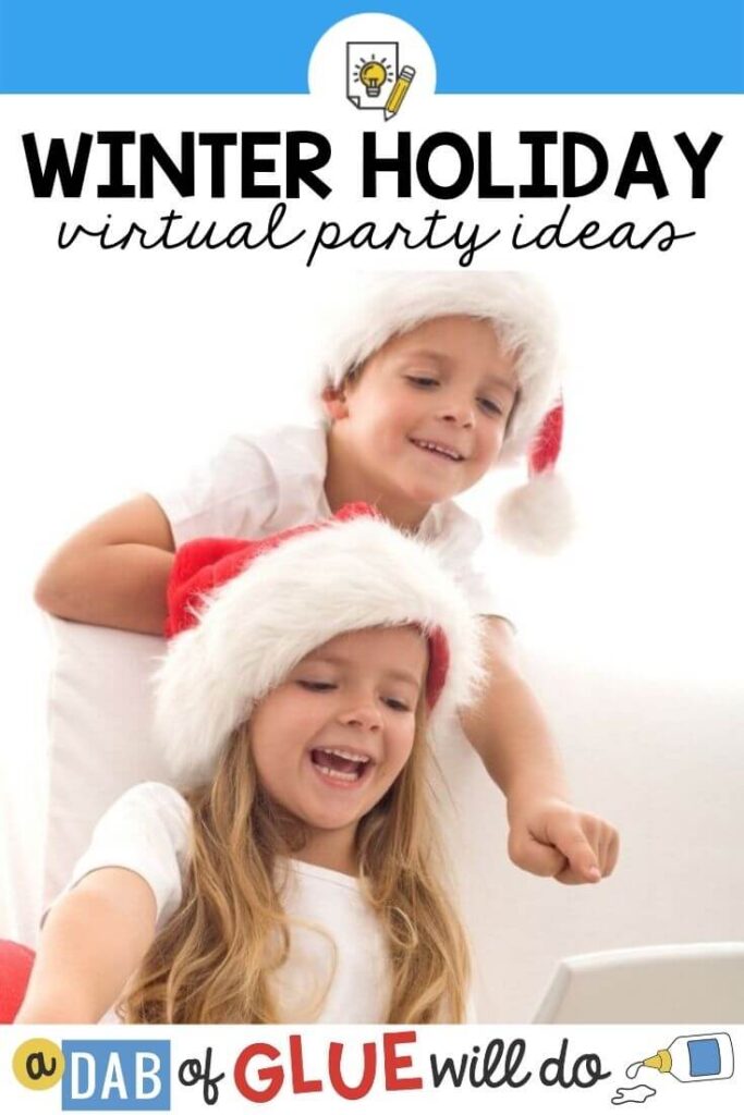 Two kids in santa hats pointing and looking at a screen